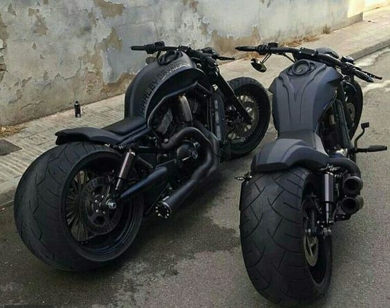 two fat blacked out motorcycles