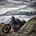 bmw motorcycle with tent and mountains