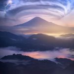 colorful clouds and lightning over mountain