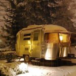 old school camper in the snow