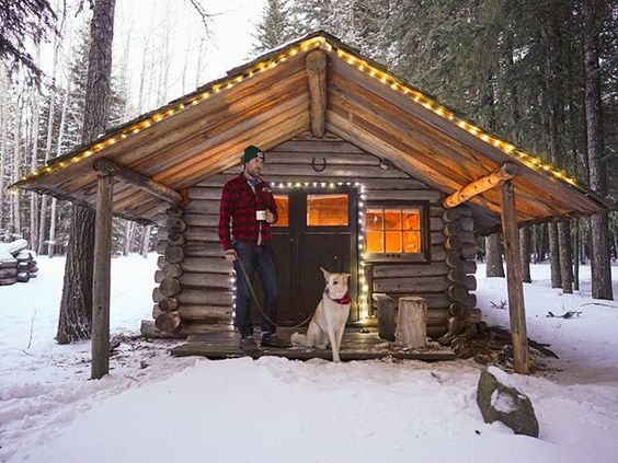 man dog cabin