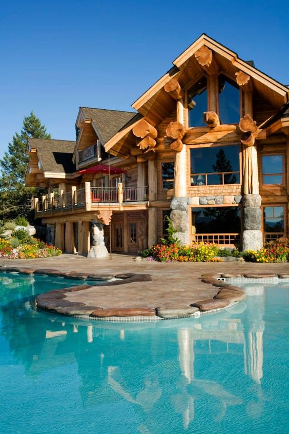 large rustic home with pool