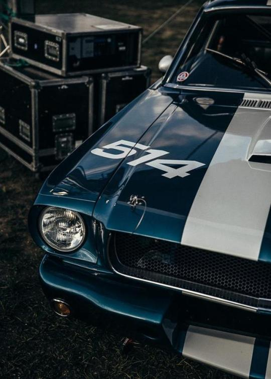 blue mustang with white racing stripe