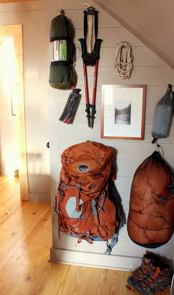 hiking gear hanging on wall