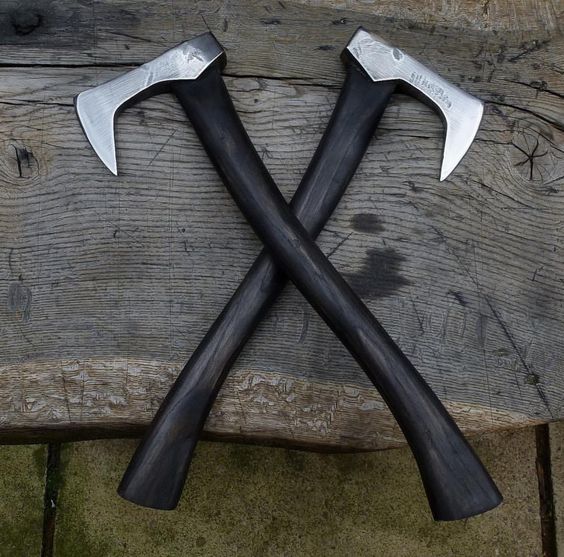 two black handled axes