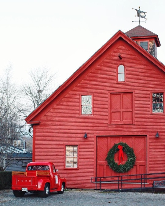 red christmas barn and red truck