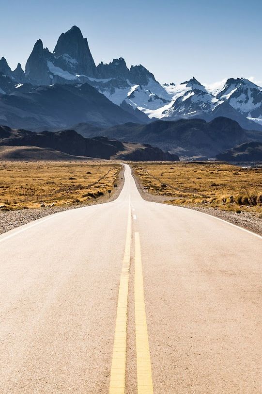 long road leading to mountains