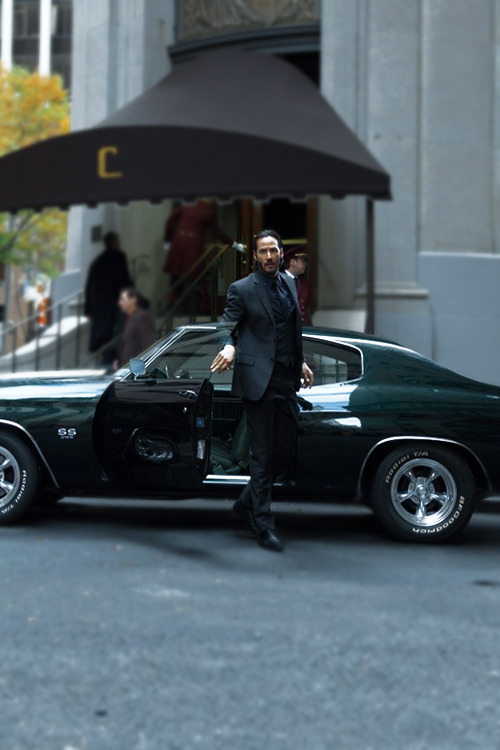 keanu reeves getting out of muscle car