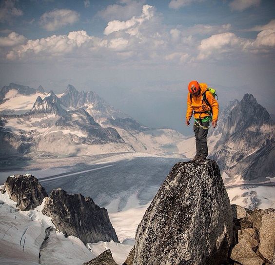 climber standing on mountain top
