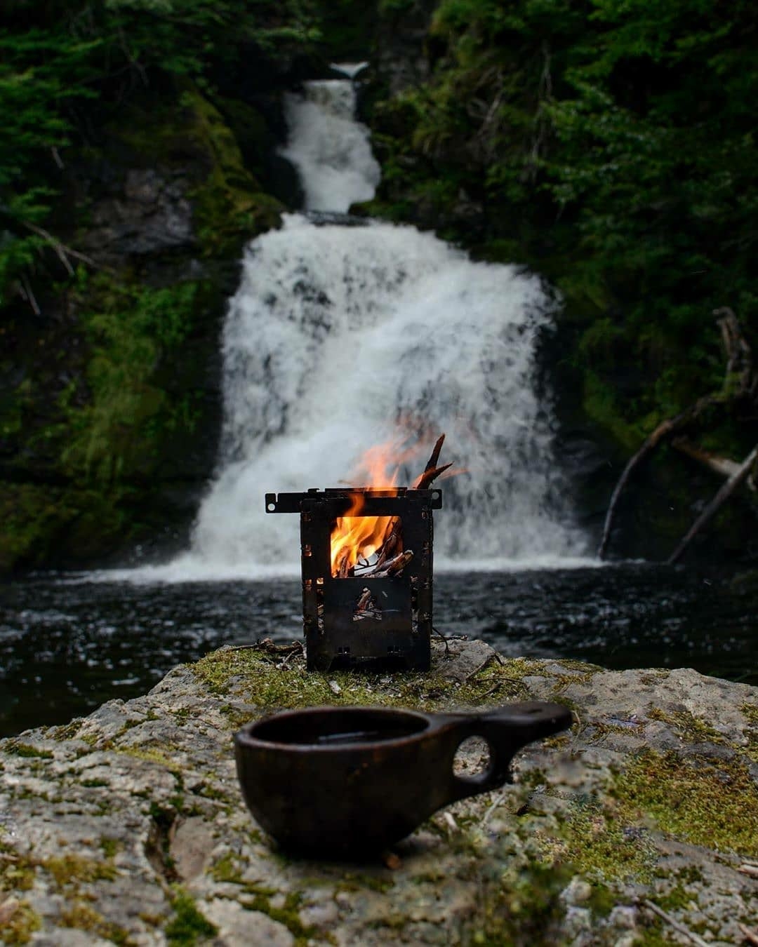 camping in front of waterfall