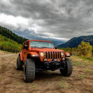 the manly life - orange jeep rubicon in the country