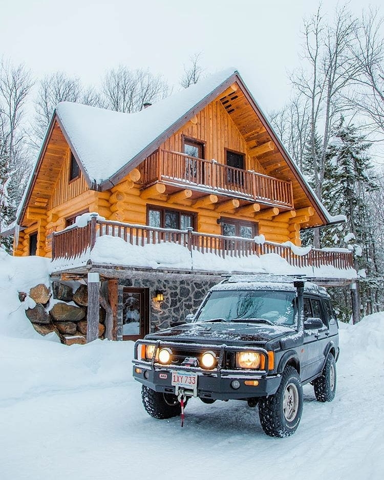 truck in front of snowy cabin
