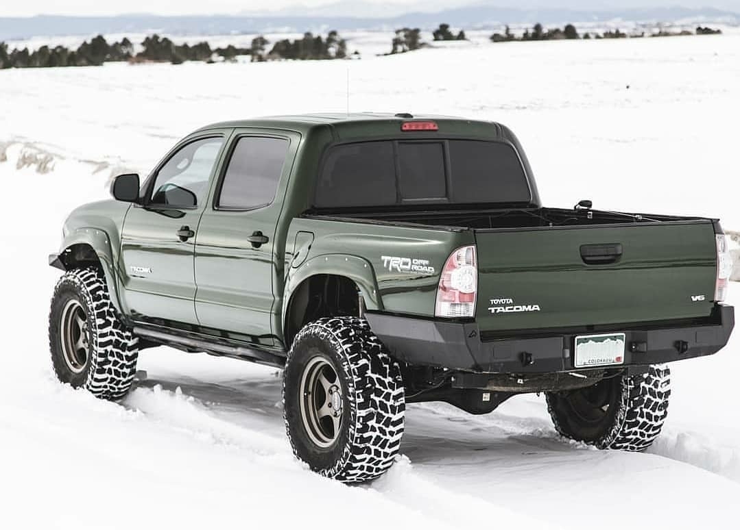 green toyota tocoma 4x4 in snow