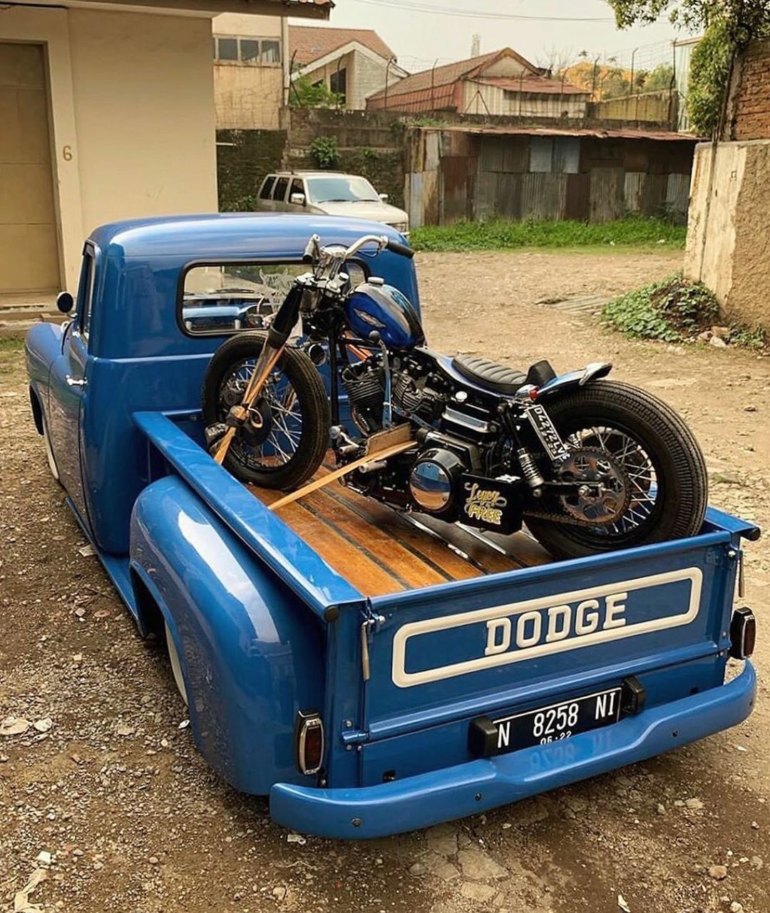 classic dodge pickup with harley in back