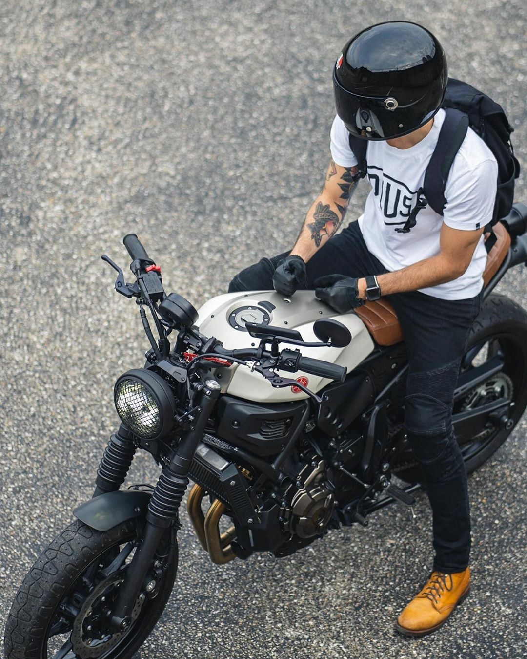 man sitting on motorcycle