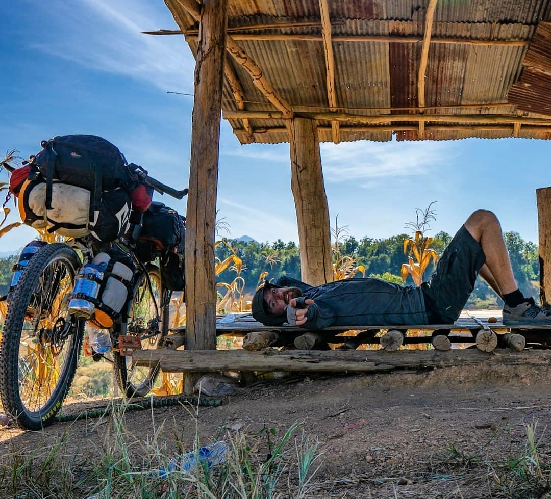 man lounging after long bike ride