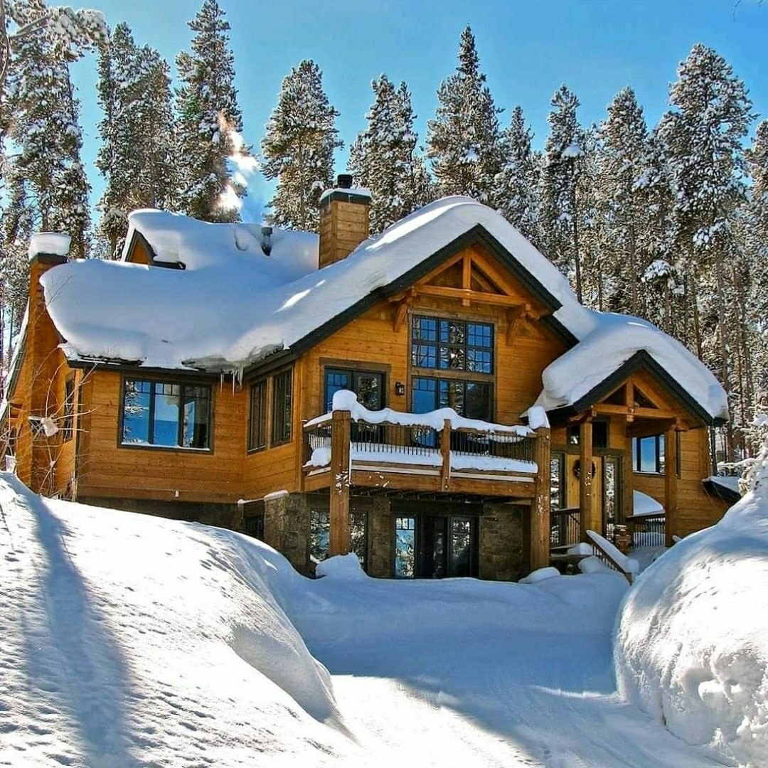 large snowy cabin in the mountains