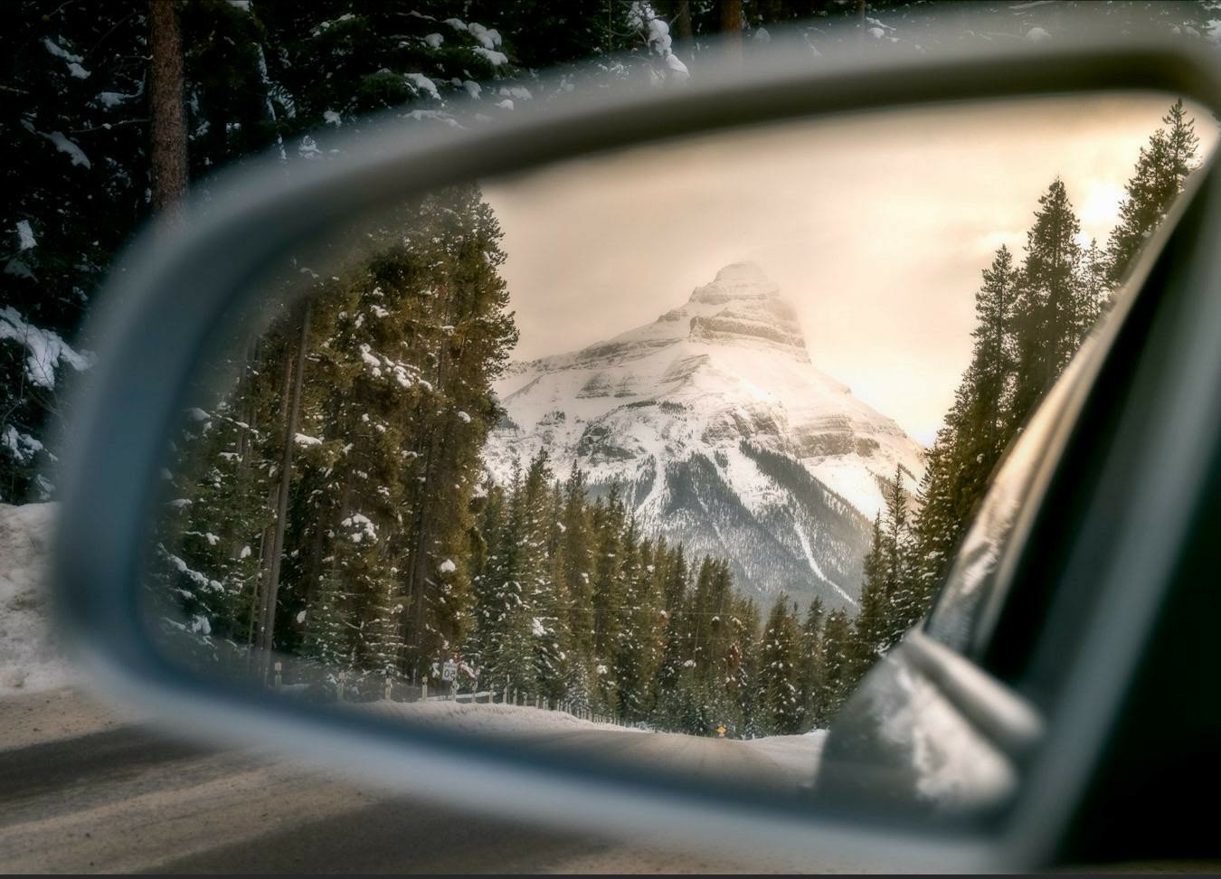 mountain scene through rear view mirror