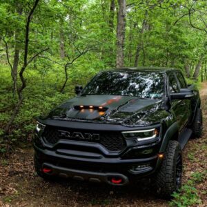 black ram truck in the woods
